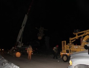 Emergency tree removal being performed at night.
